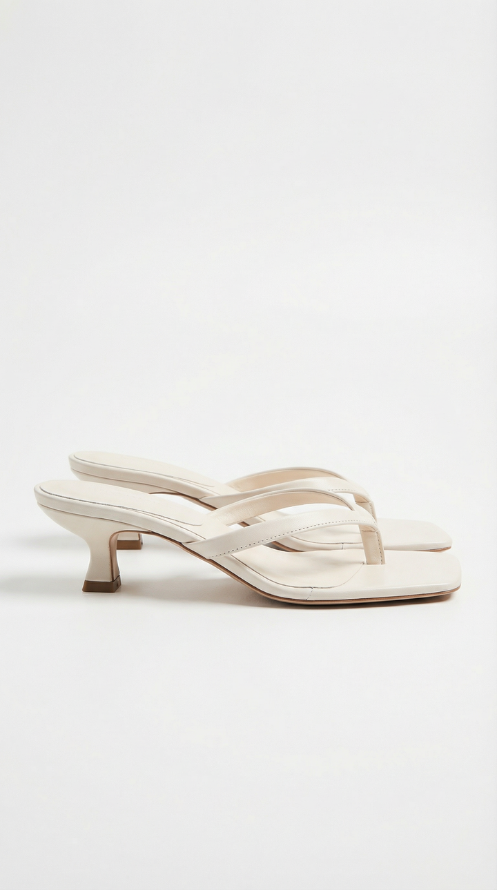 Chic women's square toe thong kitten heel sandals, designed for a sophisticated summer fashion statement.