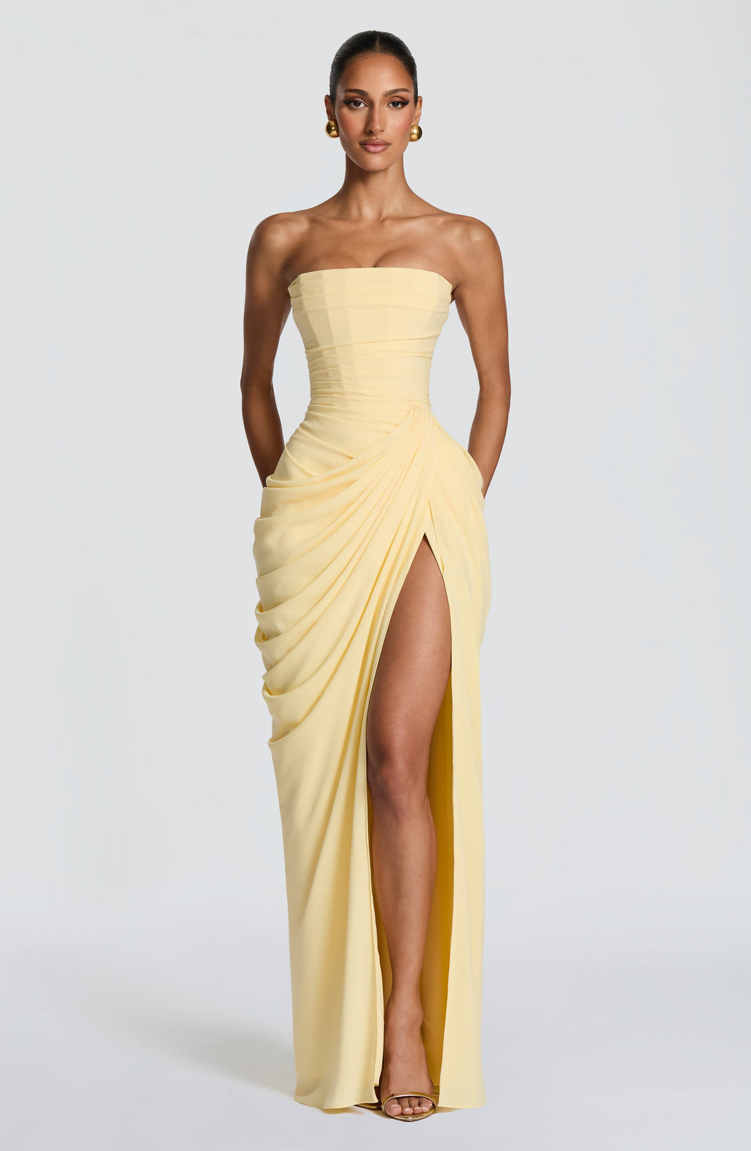 Women's elegant strapless maxi dress with corset bodice, perfect for formal evening or special occasions.