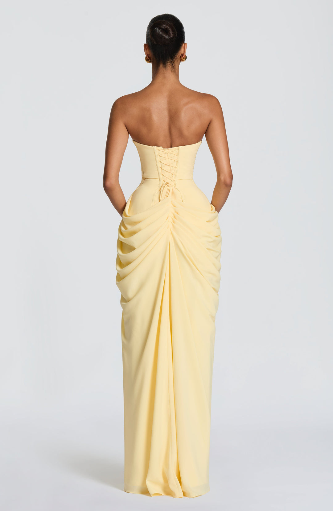 Dark blue strapless maxi dress featuring a corset bodice, sophisticated formal wear for women.