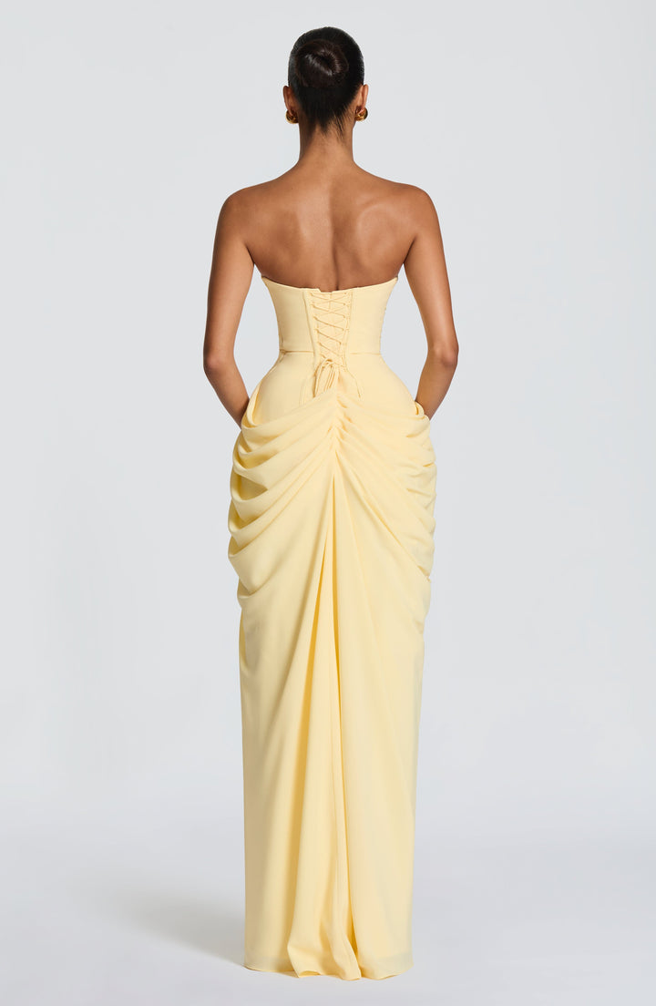 Dark blue strapless maxi dress featuring a corset bodice, sophisticated formal wear for women.