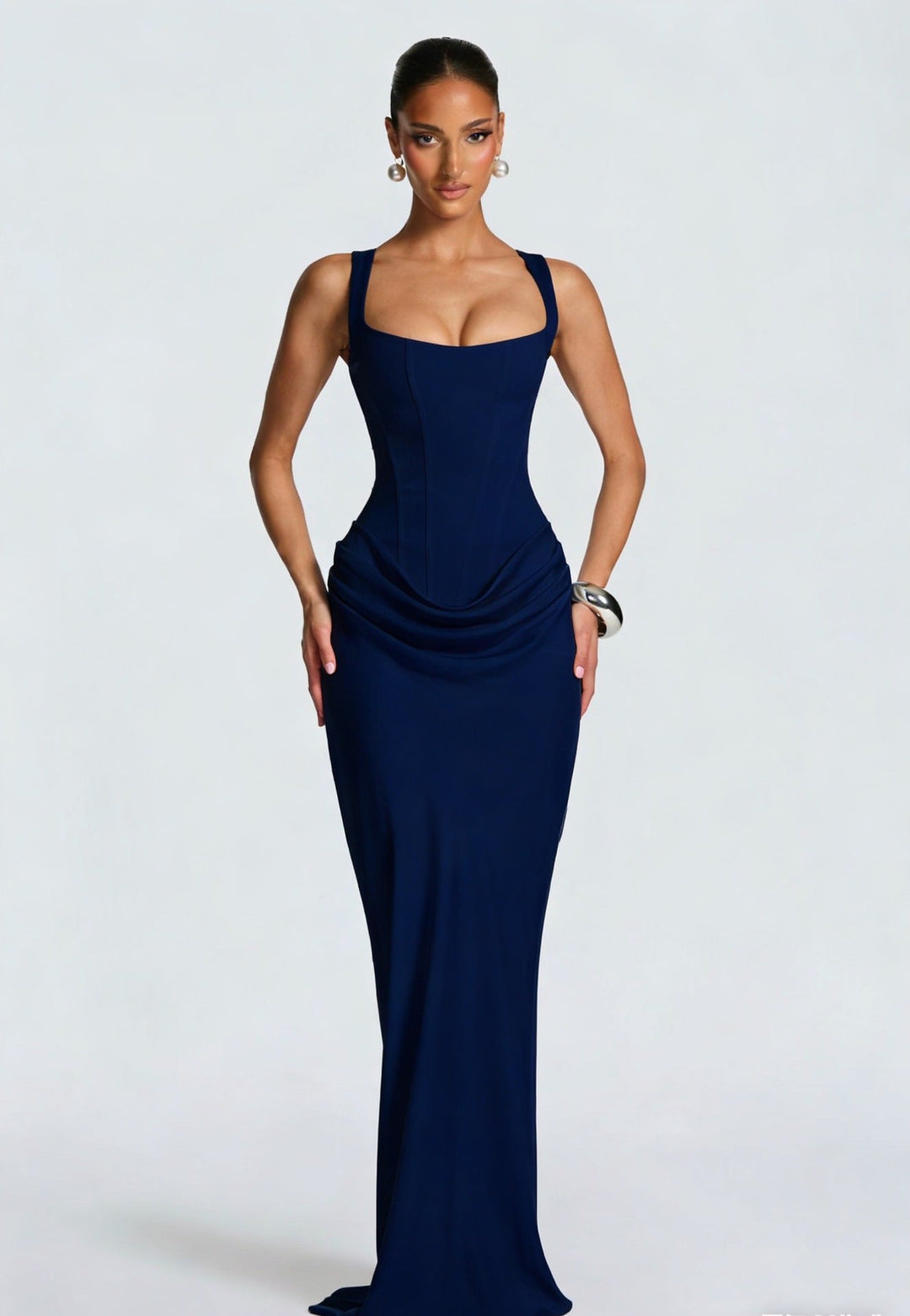 Elegant women's sleeveless maxi dress, featuring a structured corset bodice and chic draped skirt.
