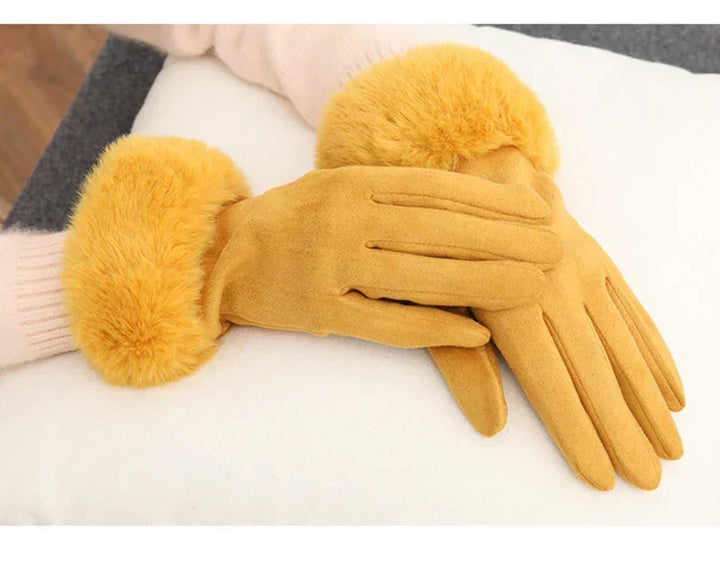Keep hands warm with these women's suede gloves & faux fur, great for winter outerwear.
