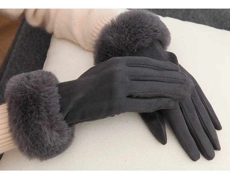 Women's high-quality suede gloves with soft faux fur trim, a cozy winter essential.