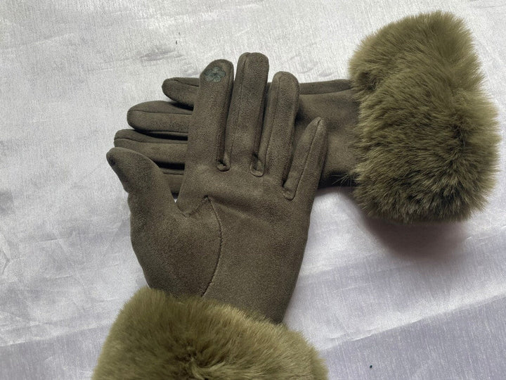 Warm & elegant women's suede gloves with faux fur trim, perfect for cold weather fashion.