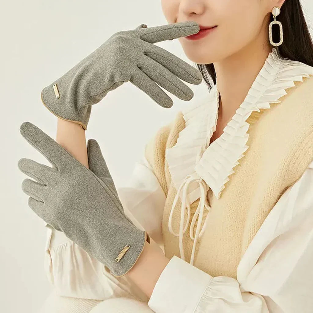 Beige women's suede winter gloves, cashmere-lined for warmth, designed with touchscreen capability.