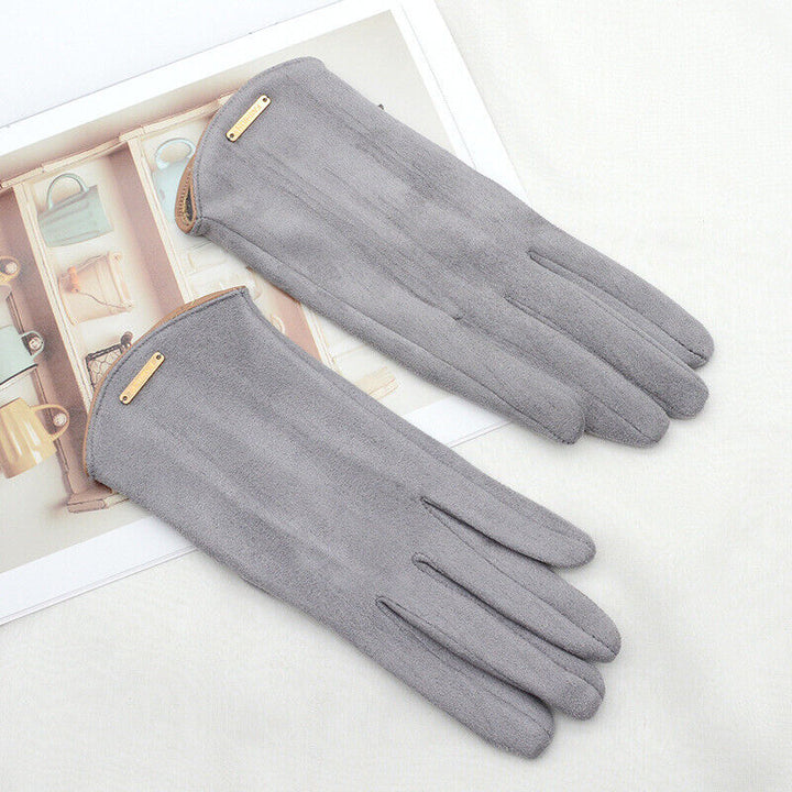 Comfortable beige women's cashmere-lined suede gloves, enabling touchscreen use in cold weather.