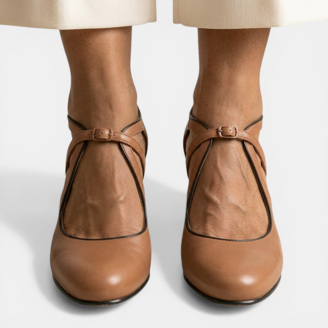 Close-up of women's T-strap high heel sandal, highlighting the adjustable buckle closure & elegant round toe design.