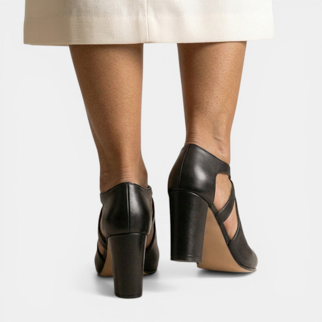 Chic women's T-strap high heel sandals, featuring a stylish round toe, high heel, and elegant buckle closure detail.