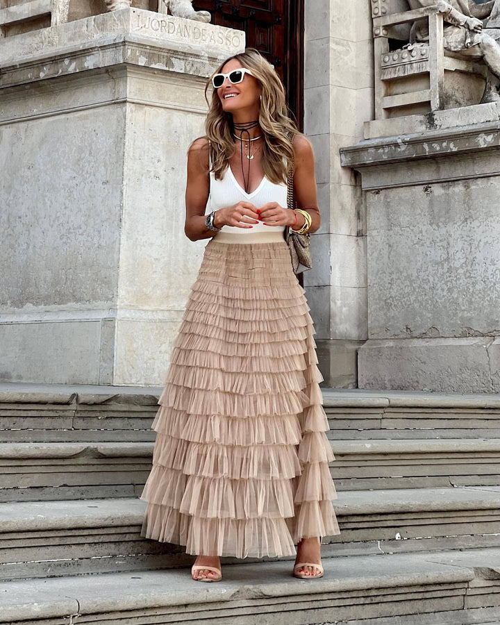 Women's elegant tiered tulle maxi skirt with ruffles, perfect for evening wear or special occasions.