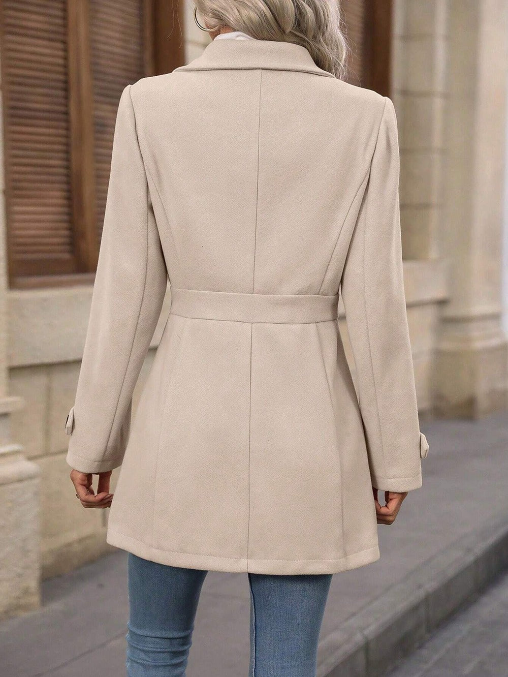 Chic black women's belted trench coat, classic collar, ideal versatile fall & winter outerwear.