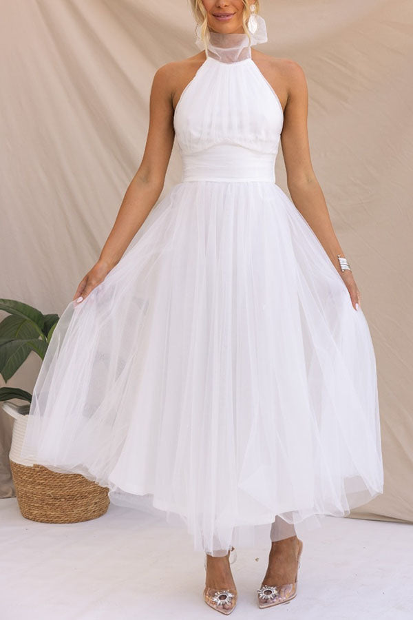 Stylish women's midi dress with flowing tulle skirt, ideal for elegant parties, weddings, or special events.