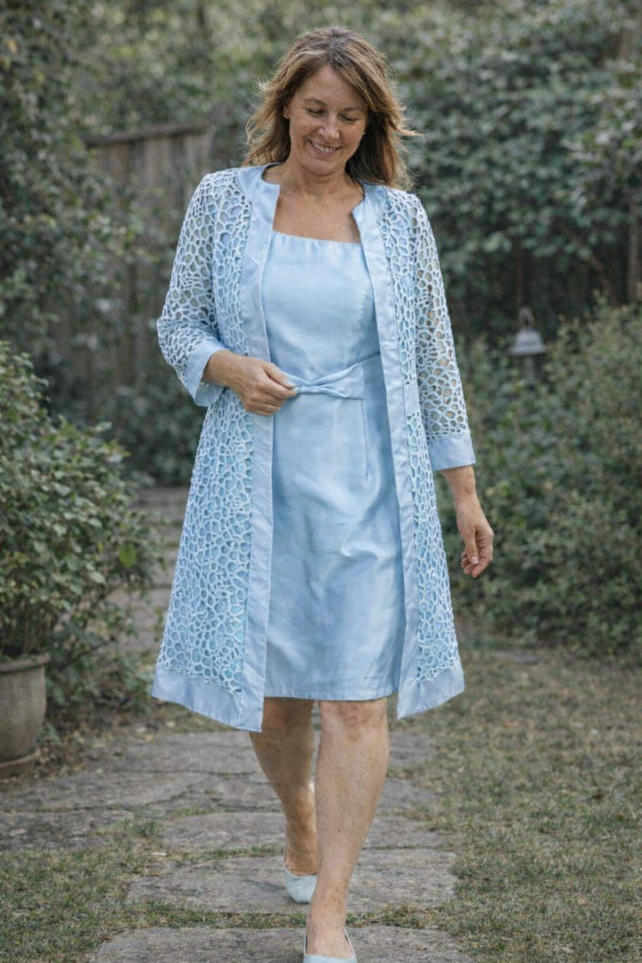 Gray women's elegant midi dress and jacket ensemble. Formal two-piece attire for special occasions.