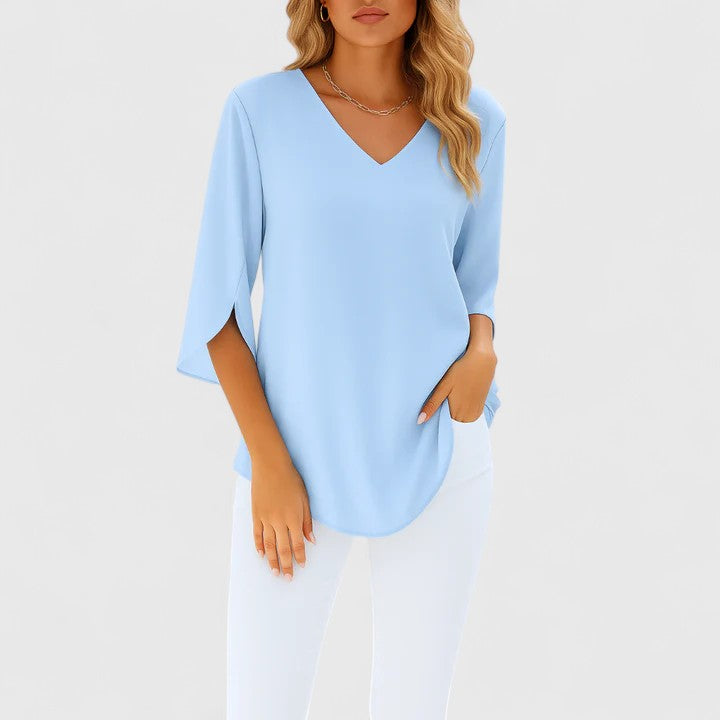 Women's elegant V-neck blouse, perfect for summer fashion & sophisticated style. A versatile ladies' top.