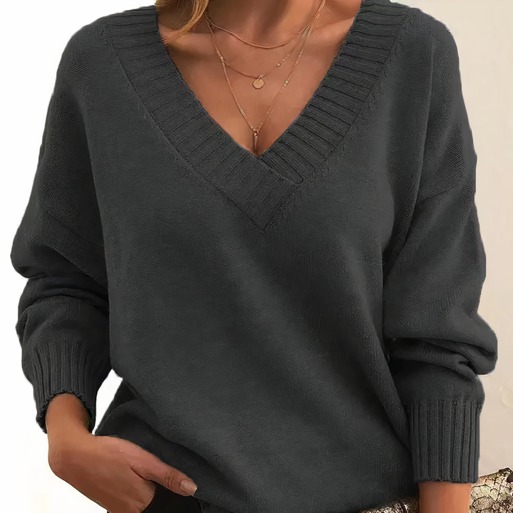 Chic women's cashmere V-neck sweater, a soft long-sleeve top ideal for elegant fall & winter fashion.