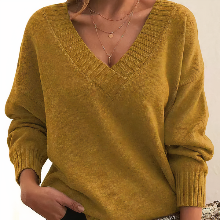Amira V-neck cashmere sweater for women, a stylish long-sleeve knit top, ideal for cozy fall & winter.