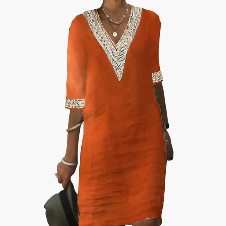 Relaxed fit women's casual shift dress with V-neck, knee-length, ideal elegant everyday summer attire.