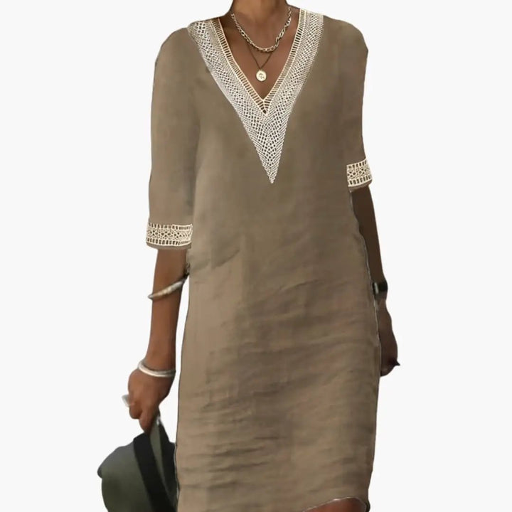 Chic women's V-neck shift dress, a versatile midi length casual and elegant piece for summer and travel.