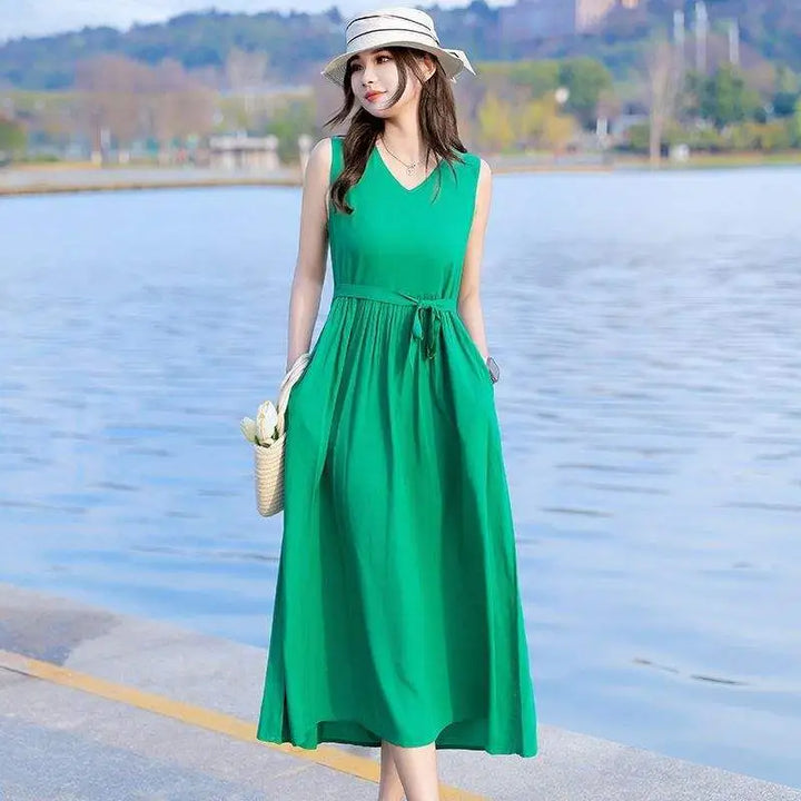 Women's sleeveless V-neck maxi dress, designed with a cinched tie waist & practical side pockets.
