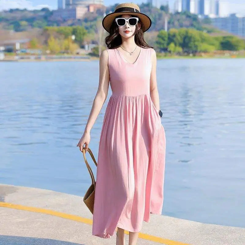 Casual women's V-neck summer maxi dress, comfortable with tie waist, sleeveless cut & useful pockets.