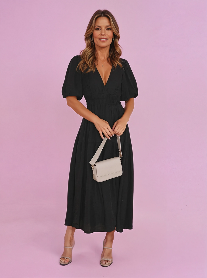 Women's elegant V-neck midi dress with chic puff sleeves and smocked waist, perfect for summer.
