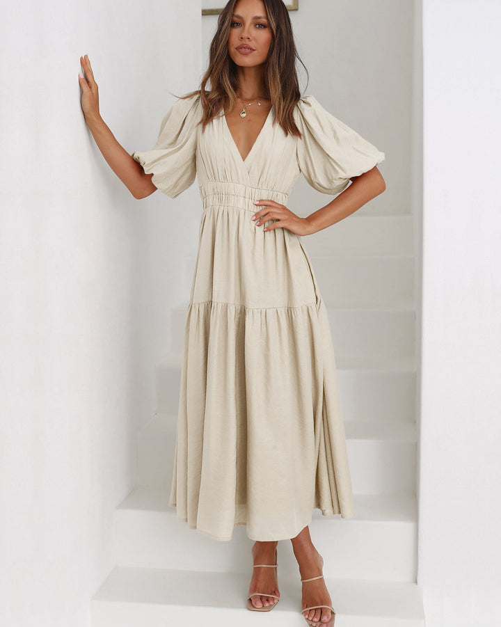 Stylish puff sleeve midi dress, a women's V-neck design with elegant smocked waist, versatile for any event.