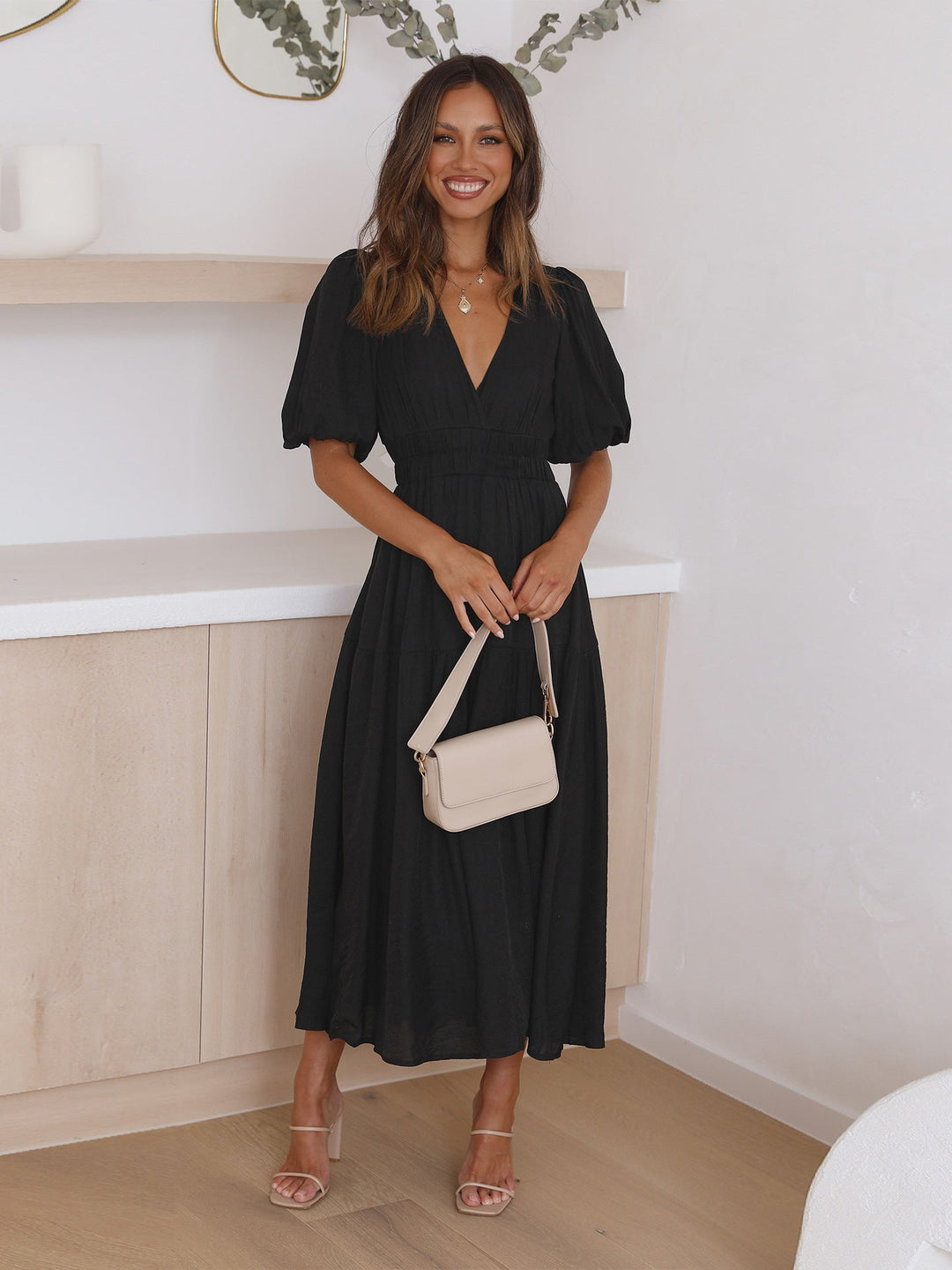 Versatile women's V-neck midi dress with puff sleeves & smocked waist, ideal for day to night wear.