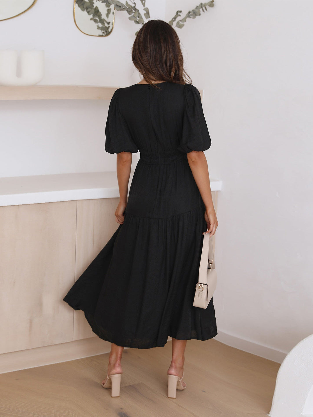 Women's V-neck midi dress, elegant puff sleeves & smocked waist. A versatile day to night summer dress.