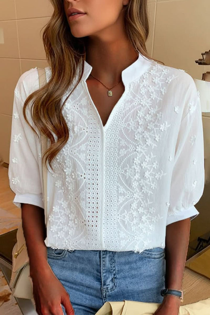 Women's elegant V-neck top, short sleeve, flattering fit for chic casual or office wear. Comfortable everyday style.