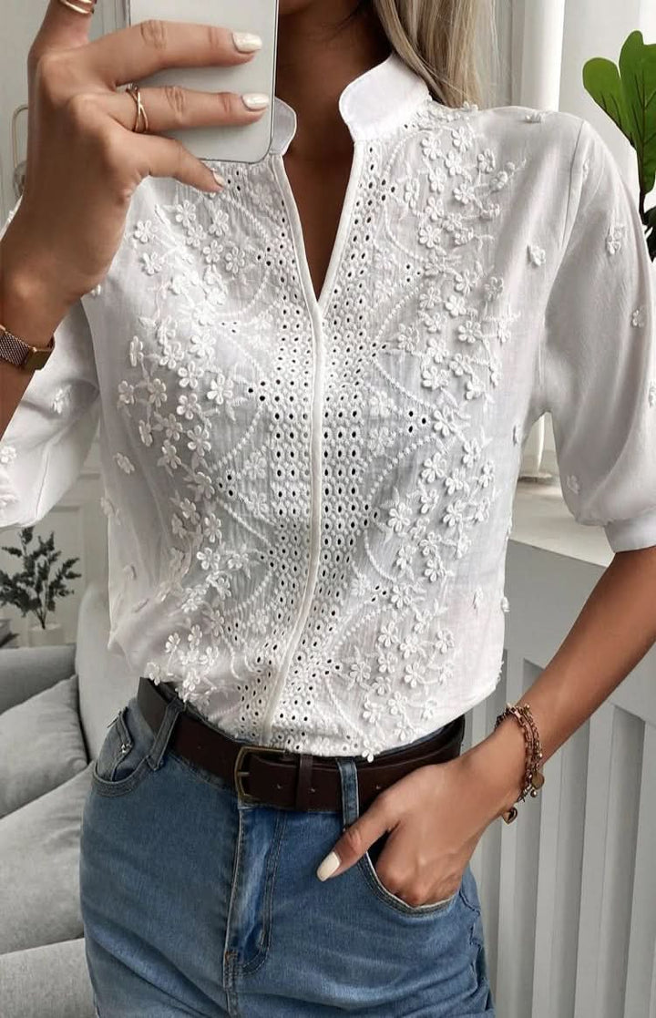 Stylish V-neck short sleeve top for women, flattering for office wear, elegant evenings, or a modern casual look.