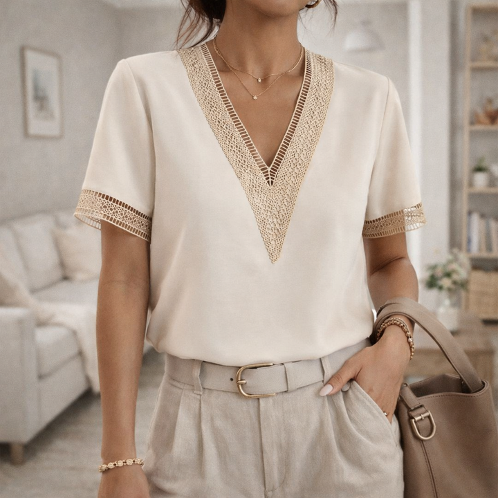 Women's elegant V-neck top with delicate lace trim. Perfect for versatile spring & summer style.