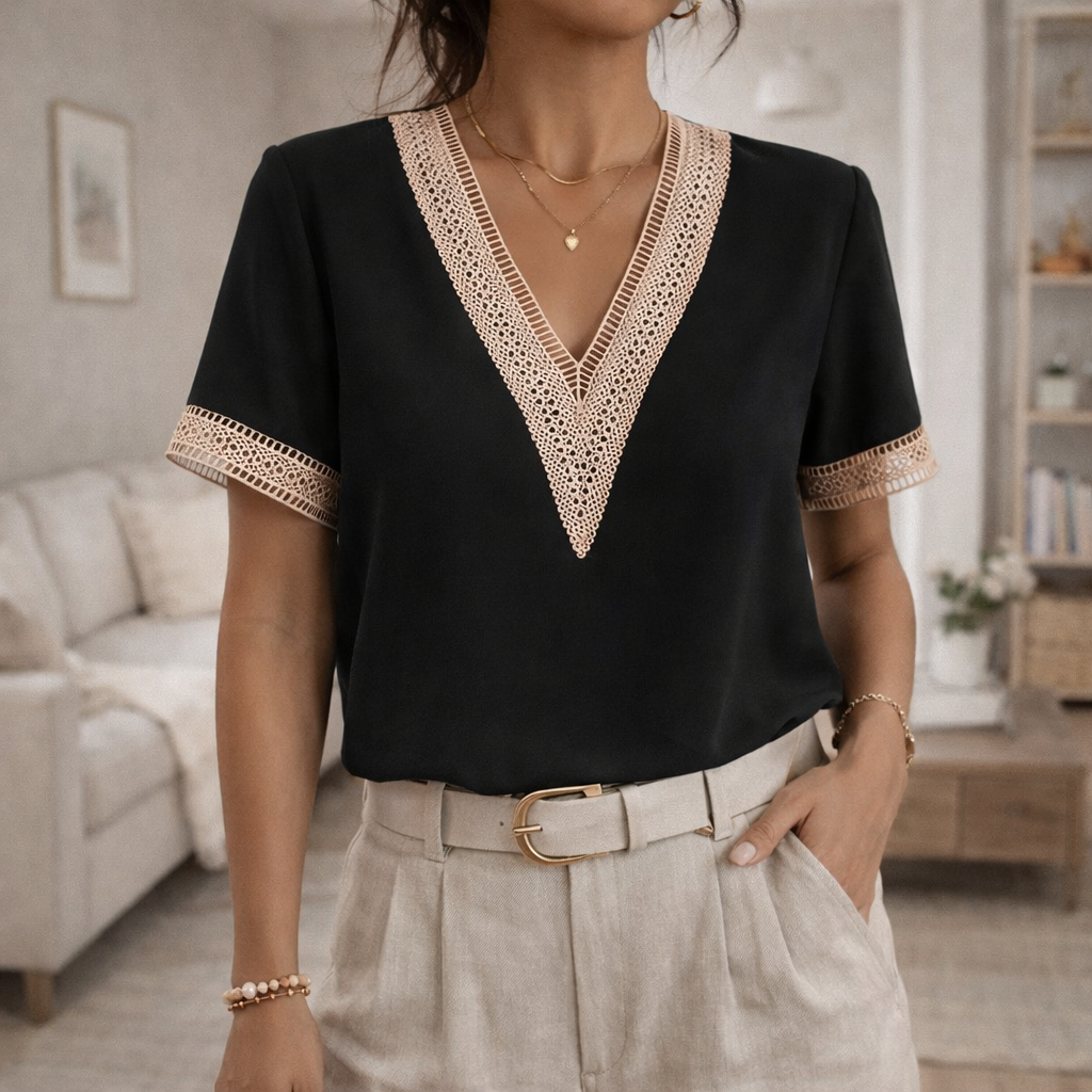 Model wearing a stylish women's V-neck top with delicate lace trim, perfect for spring casual wear.