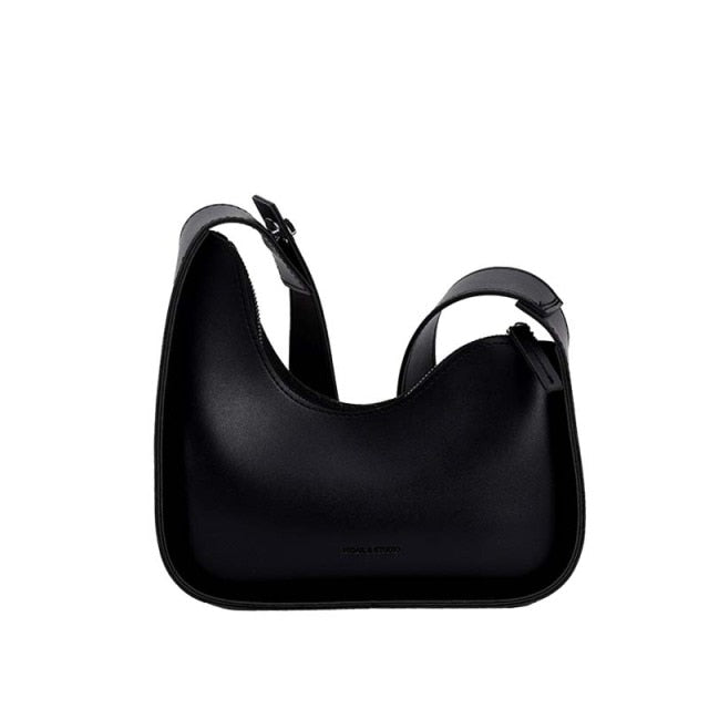 Stylish women's wave design PU leather handbag, perfect for versatile fashion.