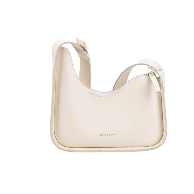 Versatile and chic women's PU leather shoulder bag featuring an elegant wave design.