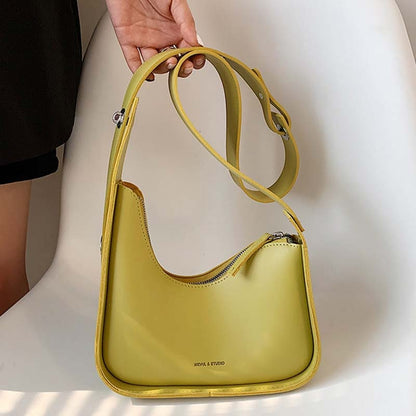 Fashionable women's accessory: PU leather shoulder bag with a unique wave design.