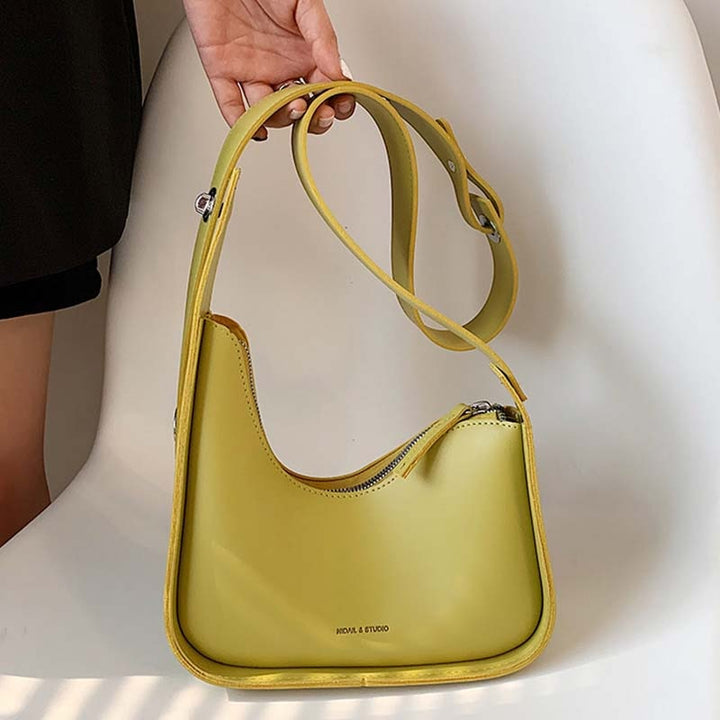 Fashionable women's accessory: PU leather shoulder bag with a unique wave design.