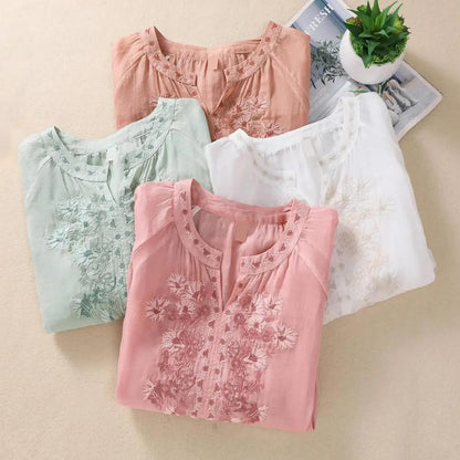Elegant women's white blouse with intricate floral embroidery, gathered details. Perfect for spring/summer.