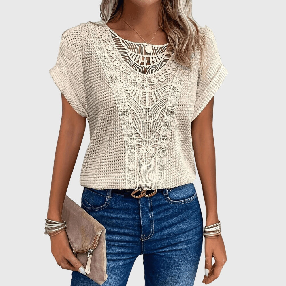 Women's elegant white lace blouse, Ibiza style, perfect for summer chic & resort wear.
