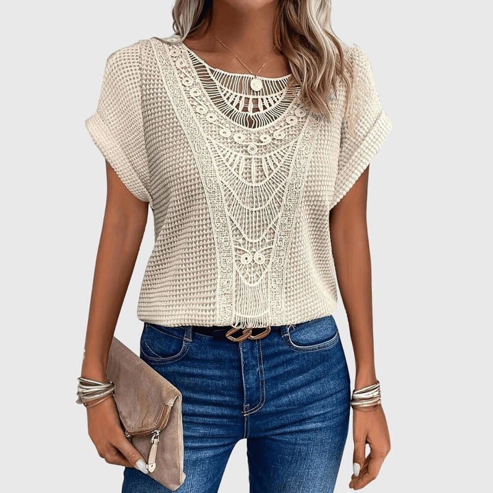 Women's elegant white lace blouse, Ibiza style, perfect for summer chic & resort wear.