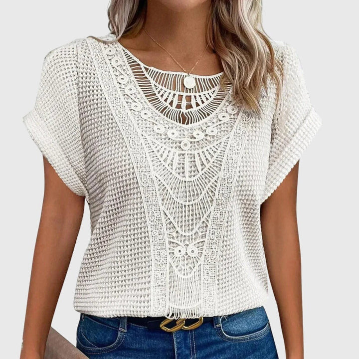 Women's stylish lace blouse, flowy Ibiza style, great for elegant summer events & resort fashion.