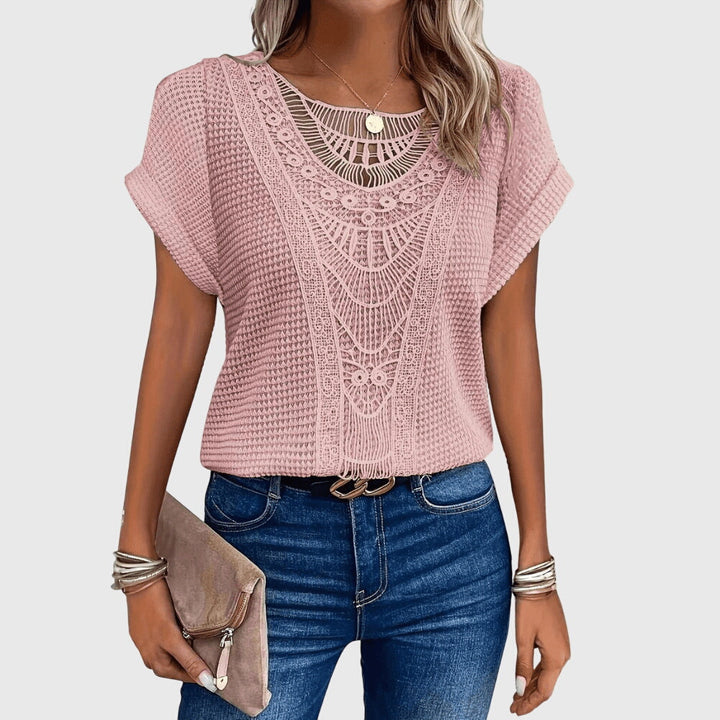 Delicate lace detailing on a women's elegant Ibiza style blouse, ideal for versatile summer fashion.