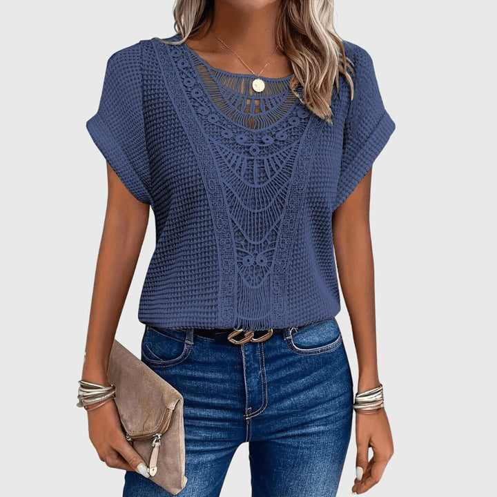 Casual chic women's lace top, versatile for beach resorts or elegant summer outings.
