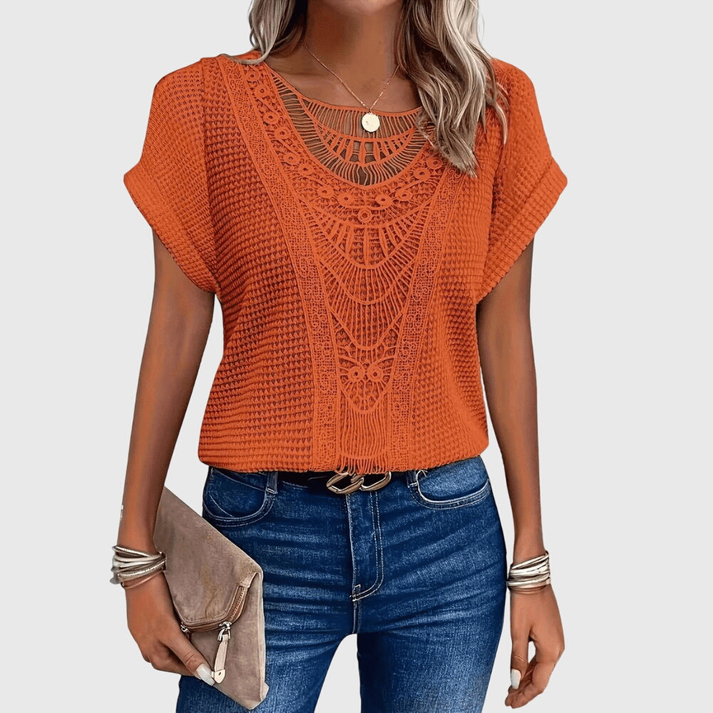 Front view of a chic women's Ibiza style lace blouse, versatile for elegant summer looks.