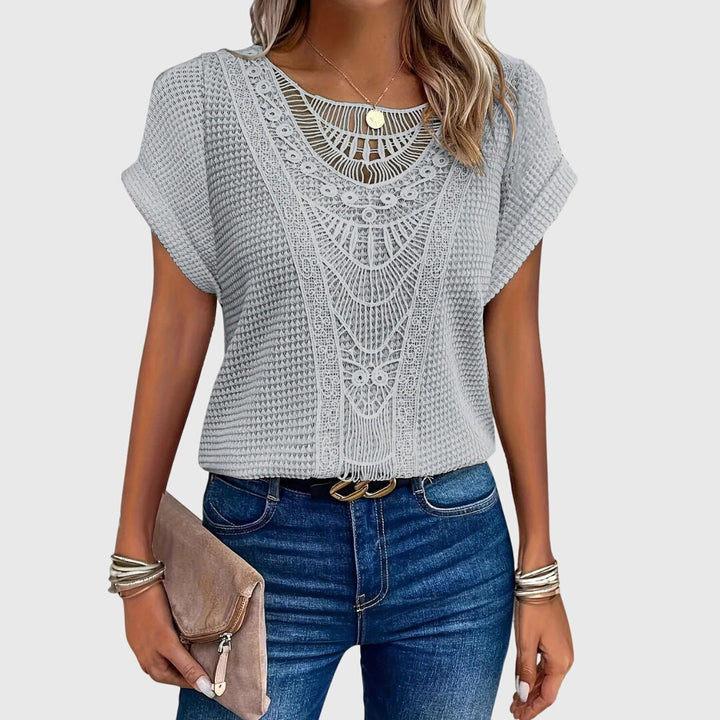 Versatile women's elegant lace blouse, perfect for casual chic or sophisticated Ibiza style.