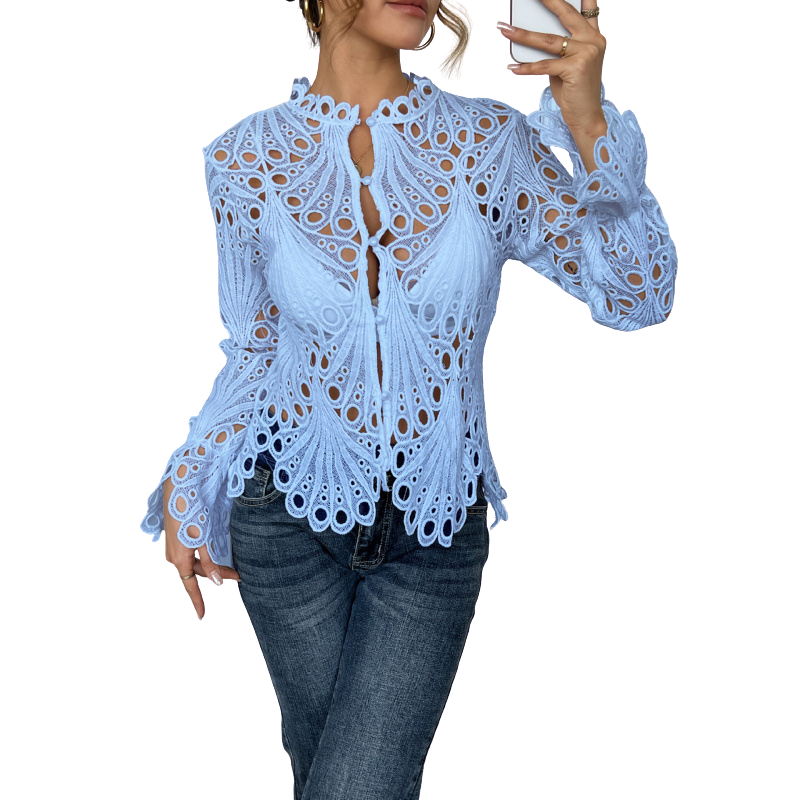 Model wearing a versatile white lace cutwork long sleeve blouse, styled for a chic casual spring fashion outfit.