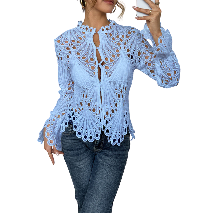 Model wearing a versatile white lace cutwork long sleeve blouse, styled for a chic casual spring fashion outfit.