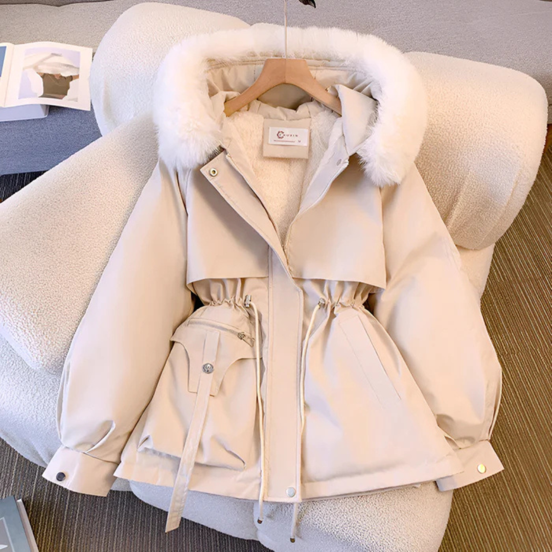 Women's elegant winter jacket. Warm, chic outerwear for cold weather. Perfect for stylish winter fashion.