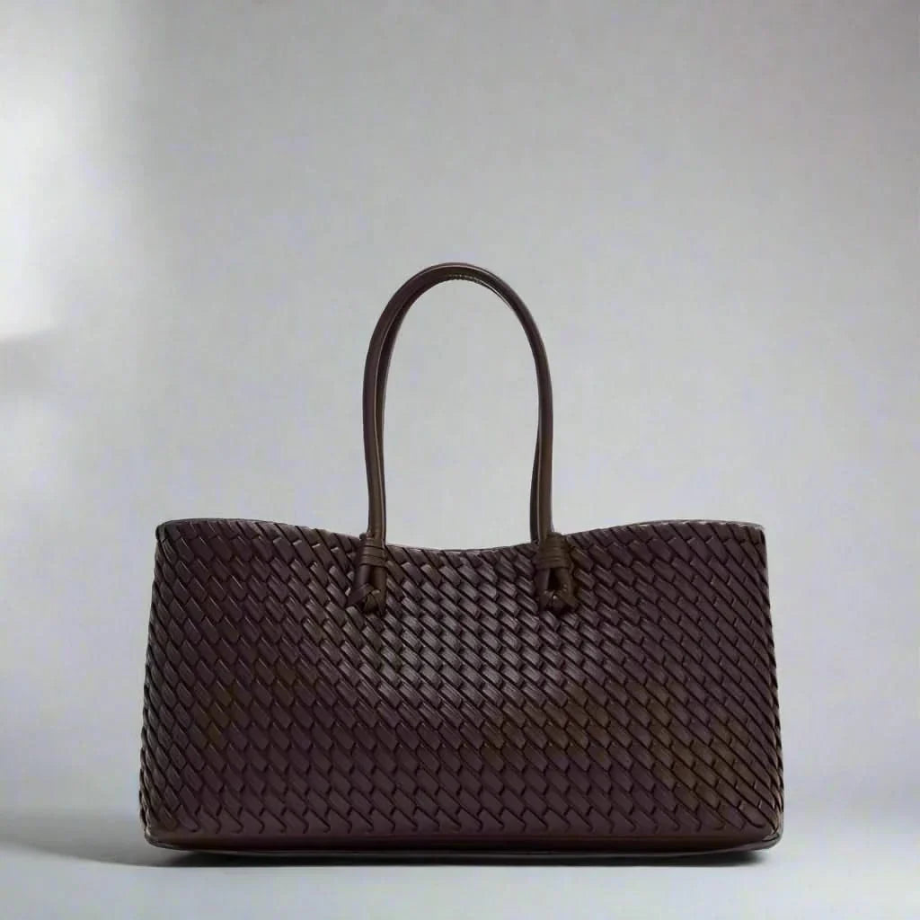 Women's elegant woven leather handbag, stylish and chic fashion accessory.