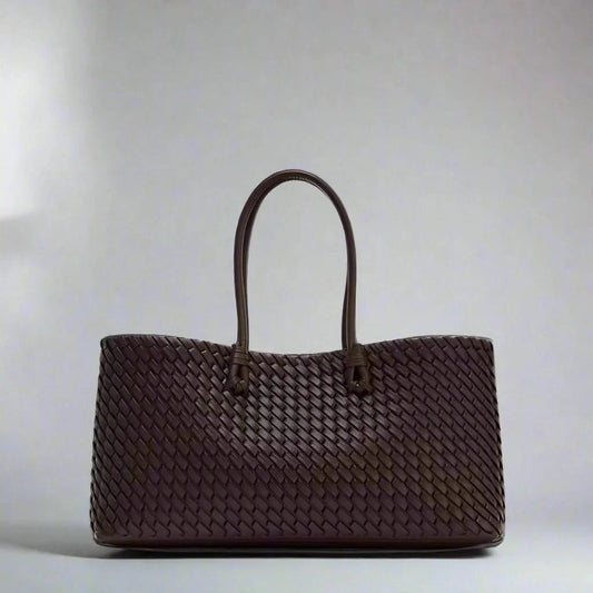 Women's elegant woven leather handbag, stylish and chic fashion accessory.