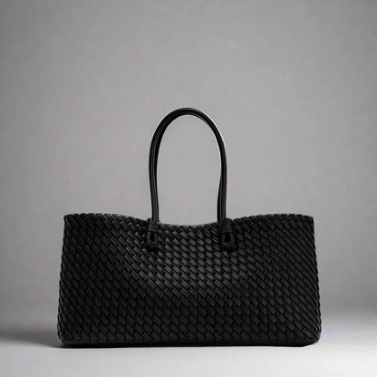 Fashionable women's elegant woven leather handbag, a stylish everyday accessory for her.