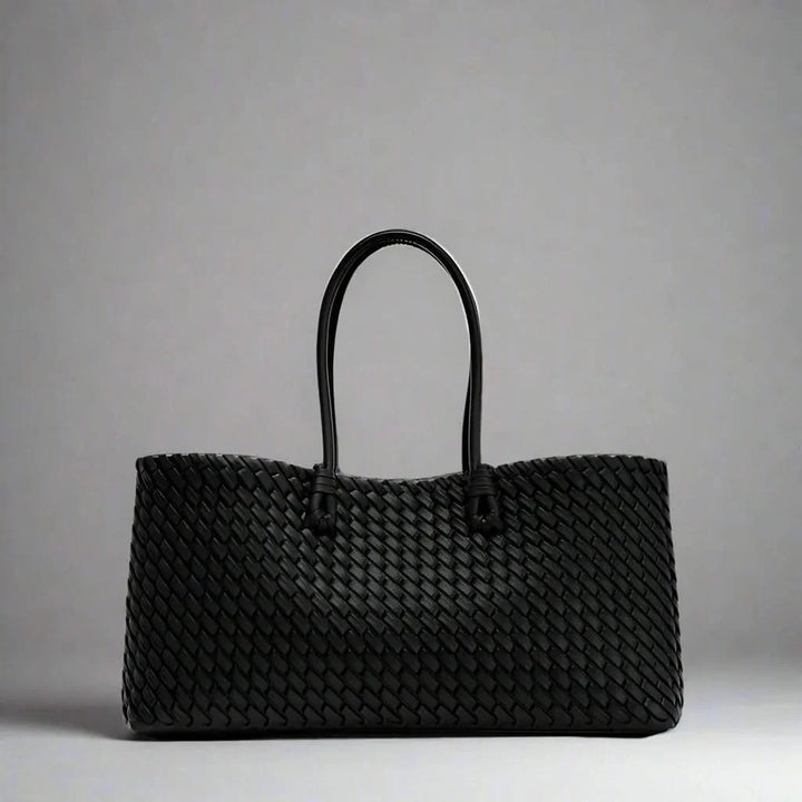 Fashionable women's elegant woven leather handbag, a stylish everyday accessory for her.